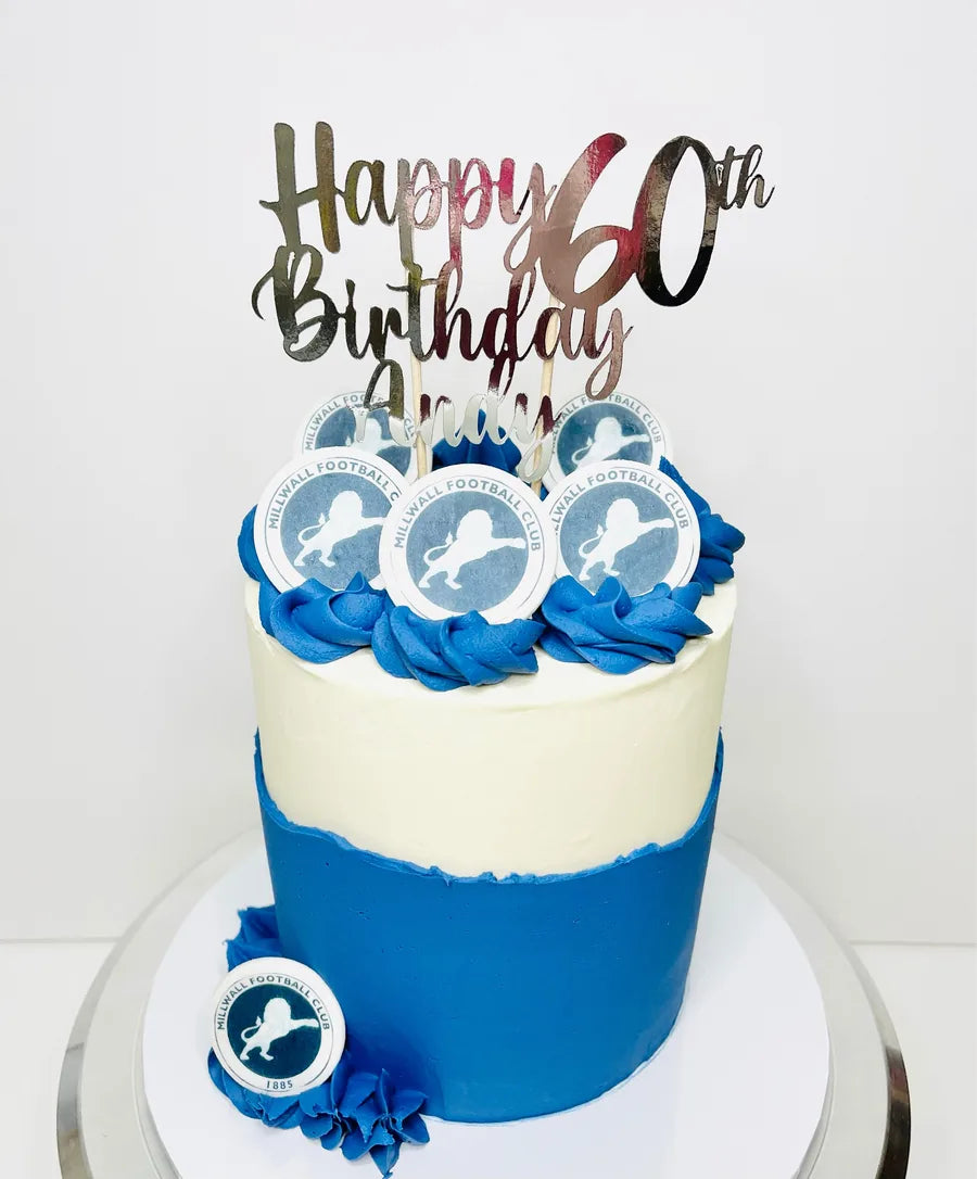 Silver mirror personalised 60th birthday cake topper on a blue and white cake